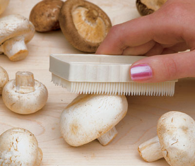 hand cleaning mushrooms